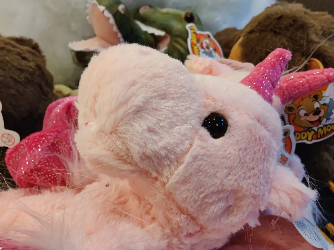 A pink unicorn plush toy